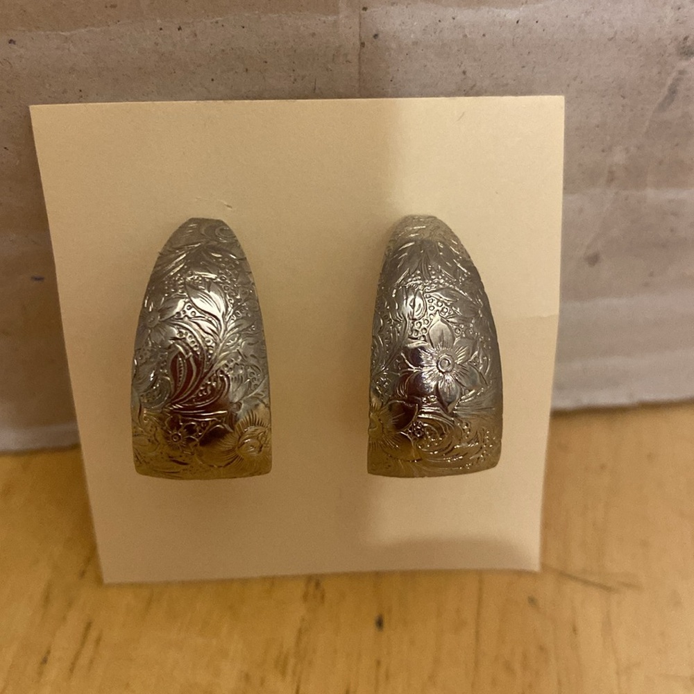 Silver tone floral Engraved post Earrings. J shaped. Almost an inch long.